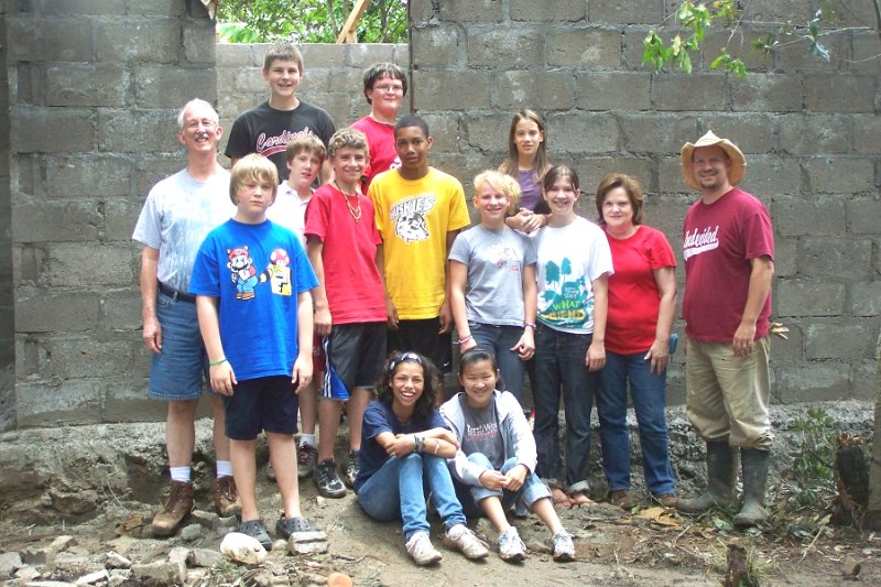 100_3576.JPG - Team in front of Dunia's family new house.